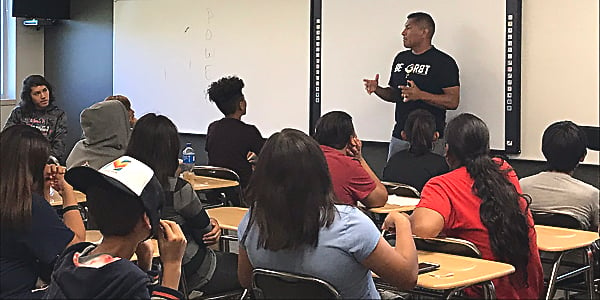 Chance Rush speaking to a group of students.