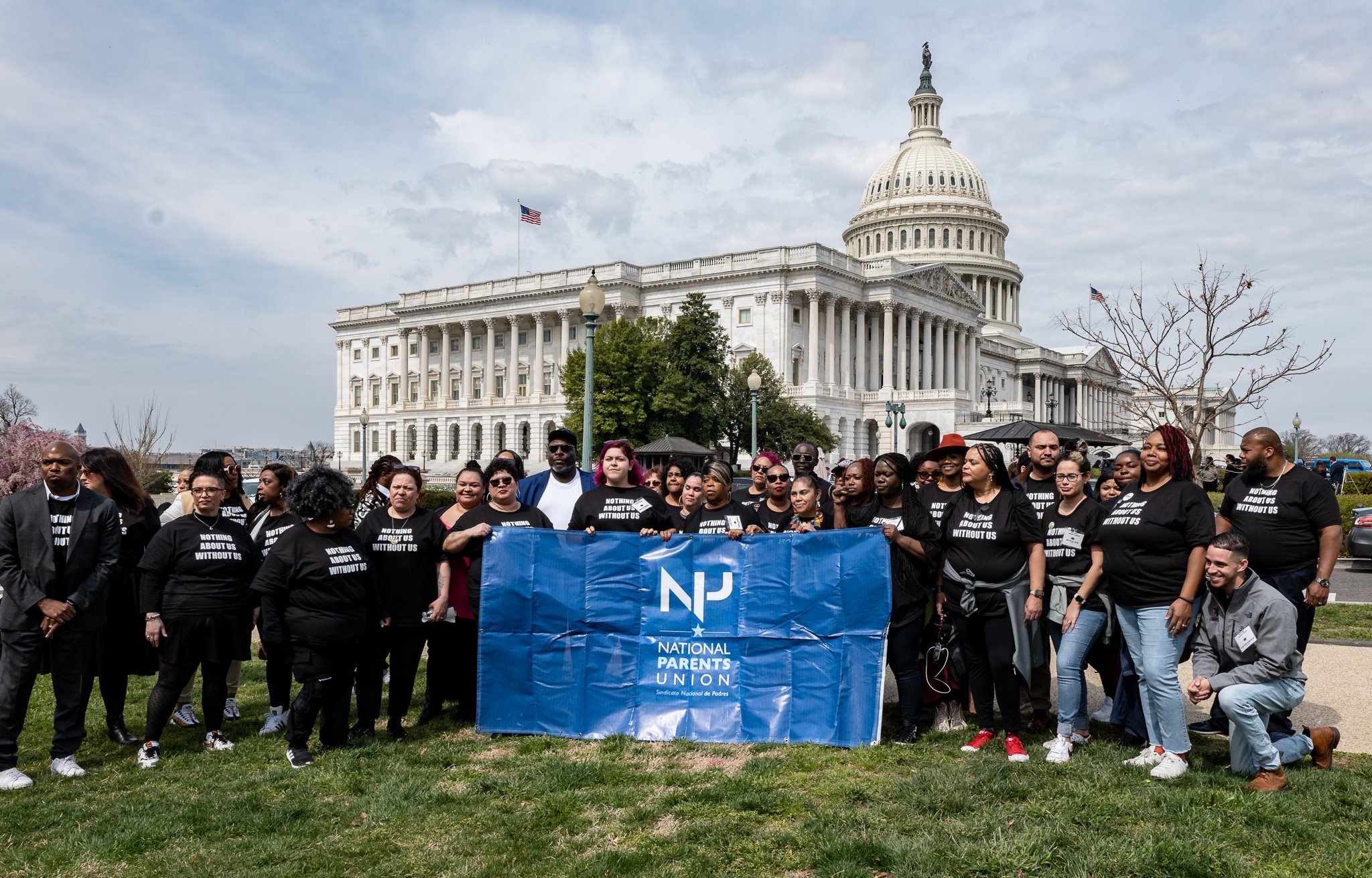 The National Parents Union stands in front of the Capitol building