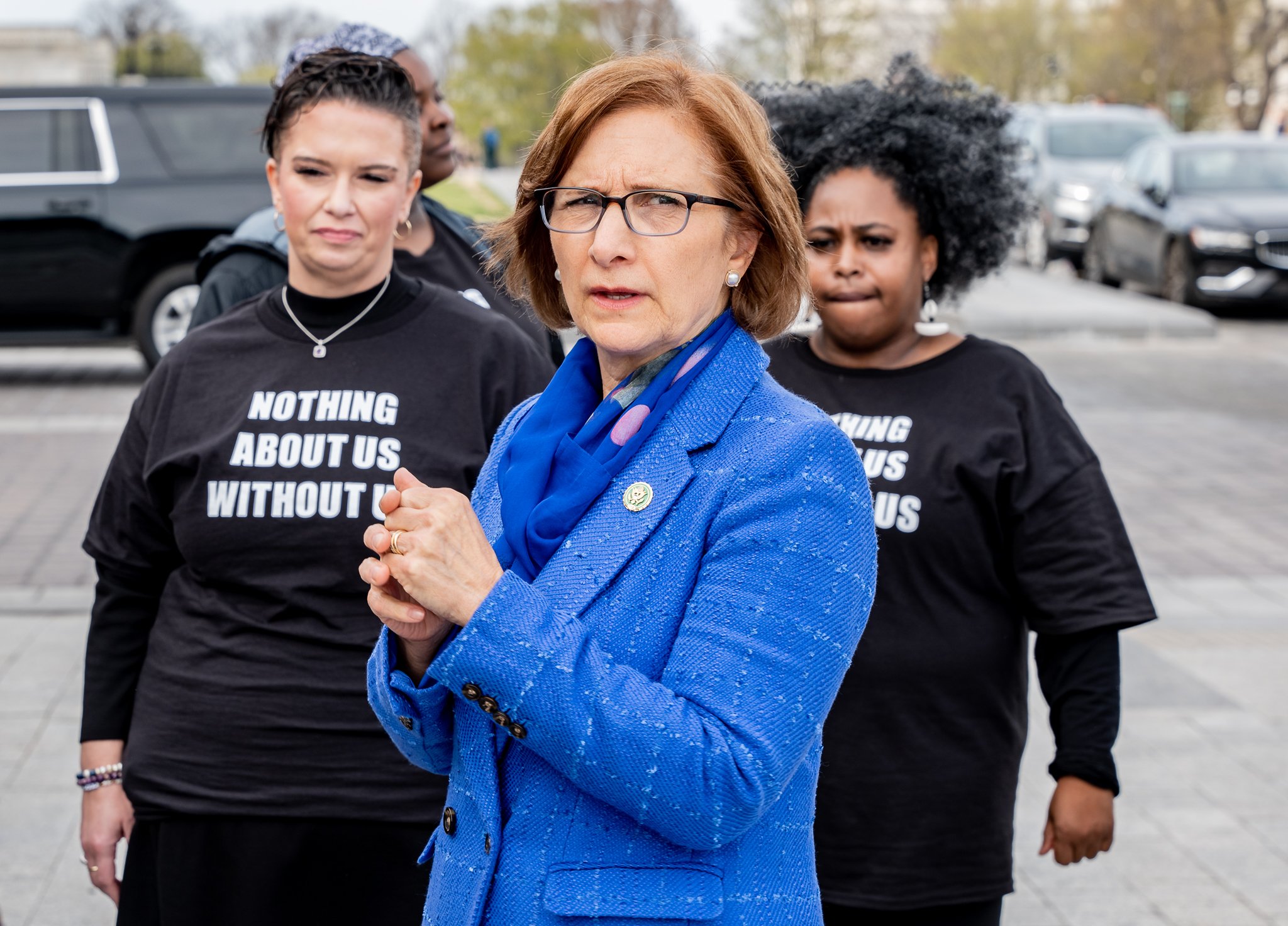 Representative Suzanne Bonamici stand in front of members of the National Parents Union