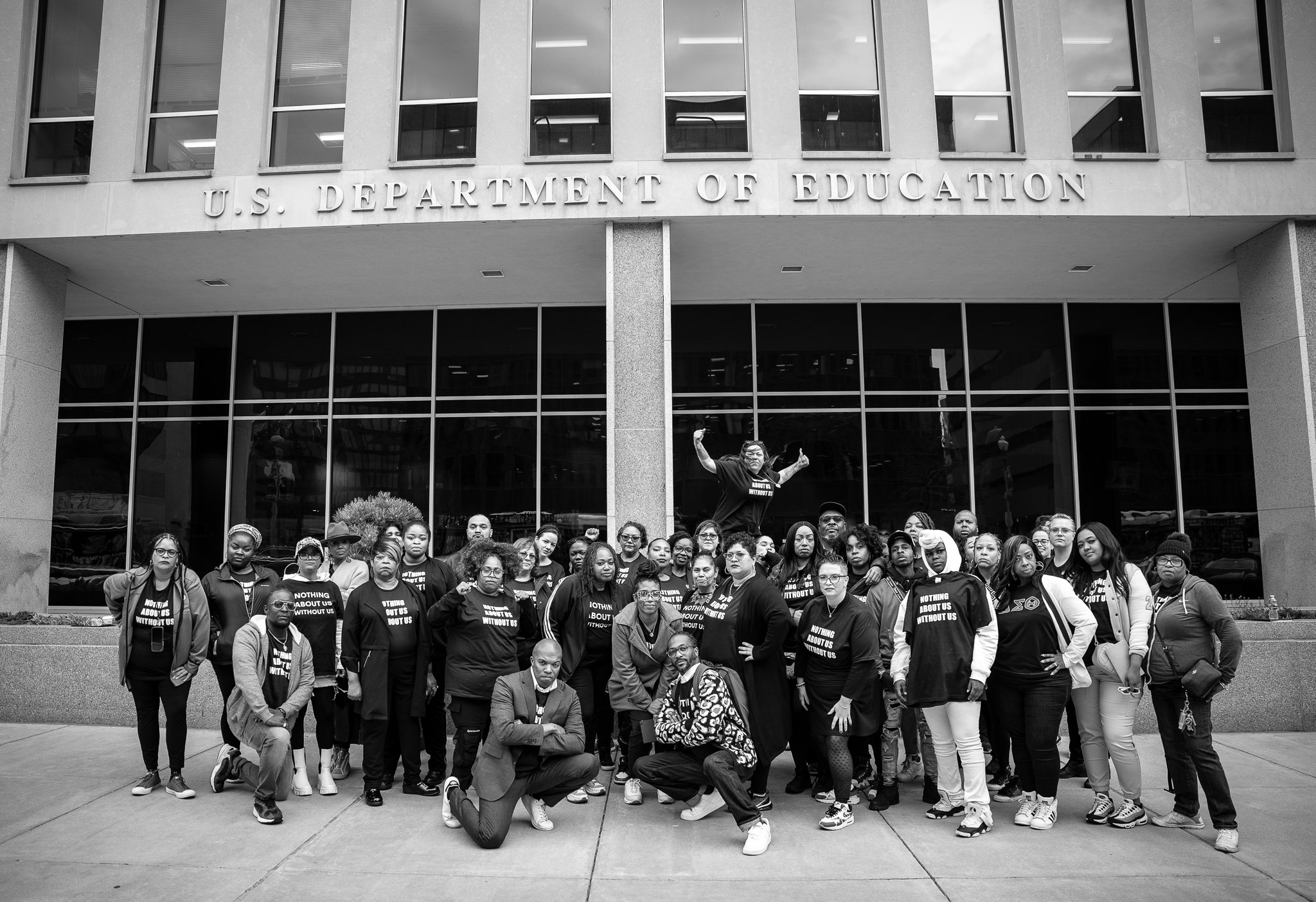 National Parents Union delegates pose for a photo in front of the Department of Education