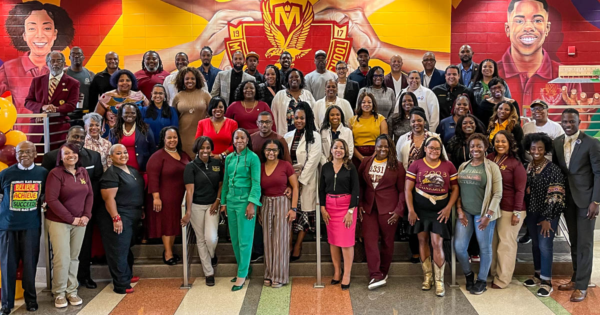 Alumni pose for a group photo at McDonogh 35 in New Orleans