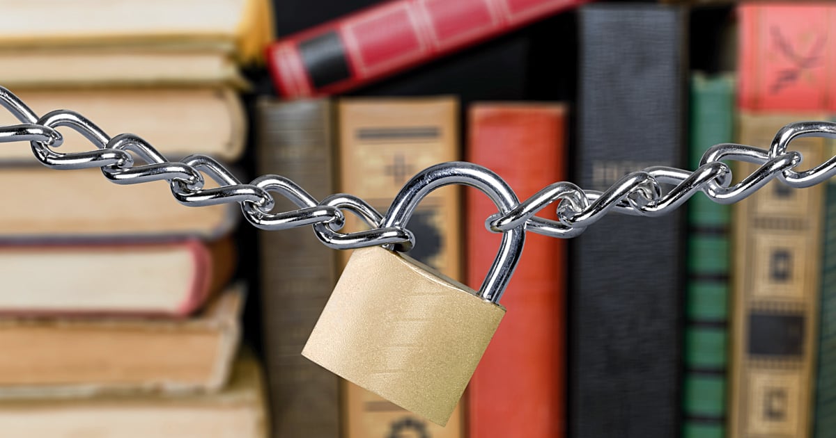 Banned Books. A shelf of books with a chain and lock.