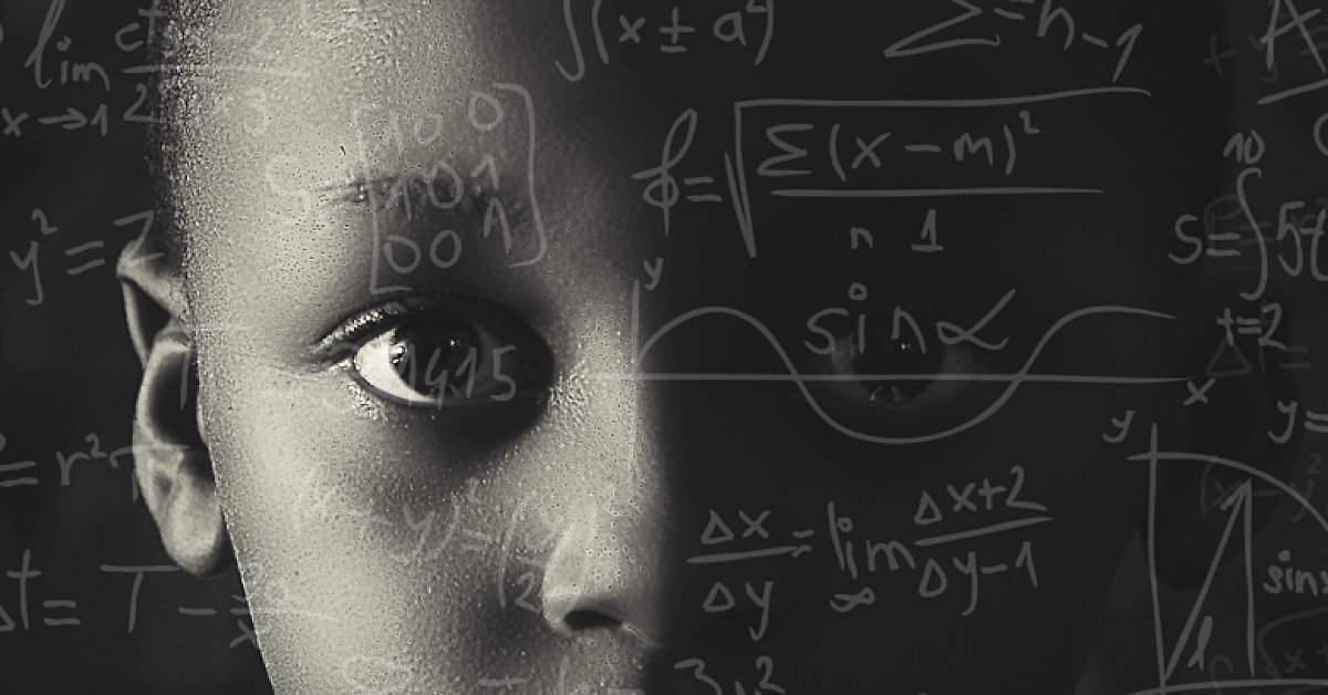 Young Black Boy with a serious expression, overlay of math equations on a blackboard