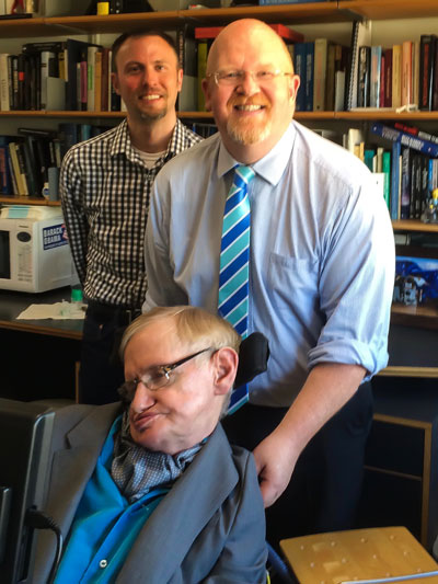 Brett Bigham with Stephen Hawking.