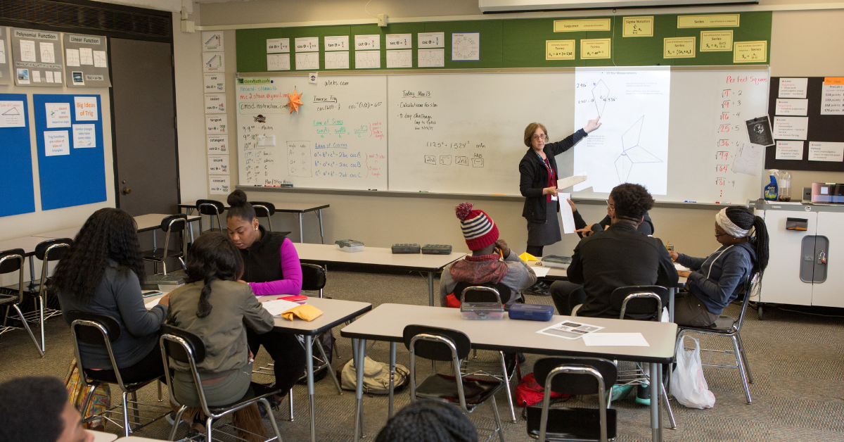 Teacher at the chalk board (educational research).