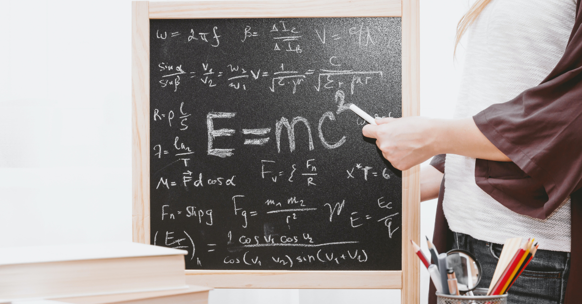 Student solving a math problem at the chalk board. Photo by JESHOOTS.COM on Unsplash 